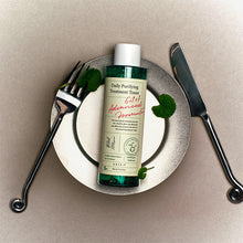 AXIS-Y Daily Purifying Treatment Toner 200ml – front of the pack: bottle on plate with cutlery | Korean Skincare Pakistan