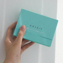 AXIS-Y The Mini Glow Set – held in hand to show the size: hand holding teal set box | Korean Skincare Pakistan