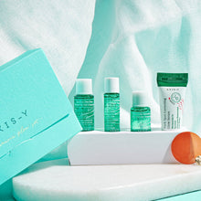 AXIS-Y The Mini Glow Set – everything included in the set: four minis beside teal box | Korean Skincare Pakistan
