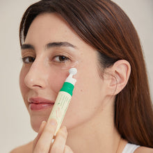 AXIS-Y Vegan Collagen Eye Serum 10ml – applied on skin: woman applying roller tip under eye | Korean Skincare Pakistan