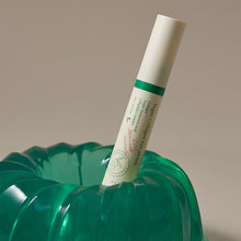 AXIS-Y Vegan Collagen Eye Serum 10ml – front of the pack: tube standing in green jelly mold | Korean Skincare Pakistan