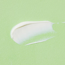 COSRX Aloe Soothing Sun Cream SPF50+ PA+++ – texture swatch: white cream smear on green | Korean Skincare Pakistan