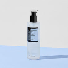 COSRX - Hyaluronic Acid Hydra Power Essence 100ml – front of the pack: pump bottle on blue surface | Korean Skincare Pakistan