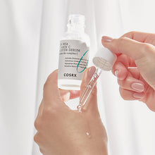 COSRX Refresh AHA BHA Vitamin C Booster Serum 30ml – held in hand to show the size | Korean Skincare Pakistan