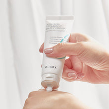 COSRX Refresh AHA BHA Vitamin C Daily Cream 50ml – applied on skin: tube squeezing cream onto hand | Korean Skincare Pakistan