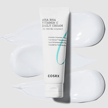 COSRX Refresh AHA BHA Vitamin C Daily Cream 50ml – texture swatch: tube over white cream smears | Korean Skincare Pakistan