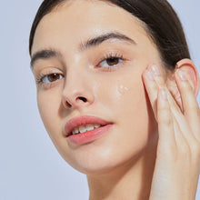 COSRX The Hyaluronic Acid 3 Serum 20ml – applied on skin: model with serum drop on cheek | Korean Skincare Pakistan