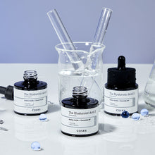 COSRX The Hyaluronic Acid 3 Serum 20ml – three serum bottles with lab glassware | Korean Skincare Pakistan