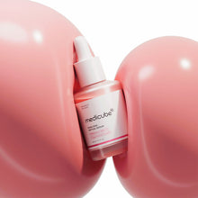 Medicube PDRN Pink Peptide Serum 30ml – front of the pack: dropper bottle between pink spheres | Korean Skincare Pakistan